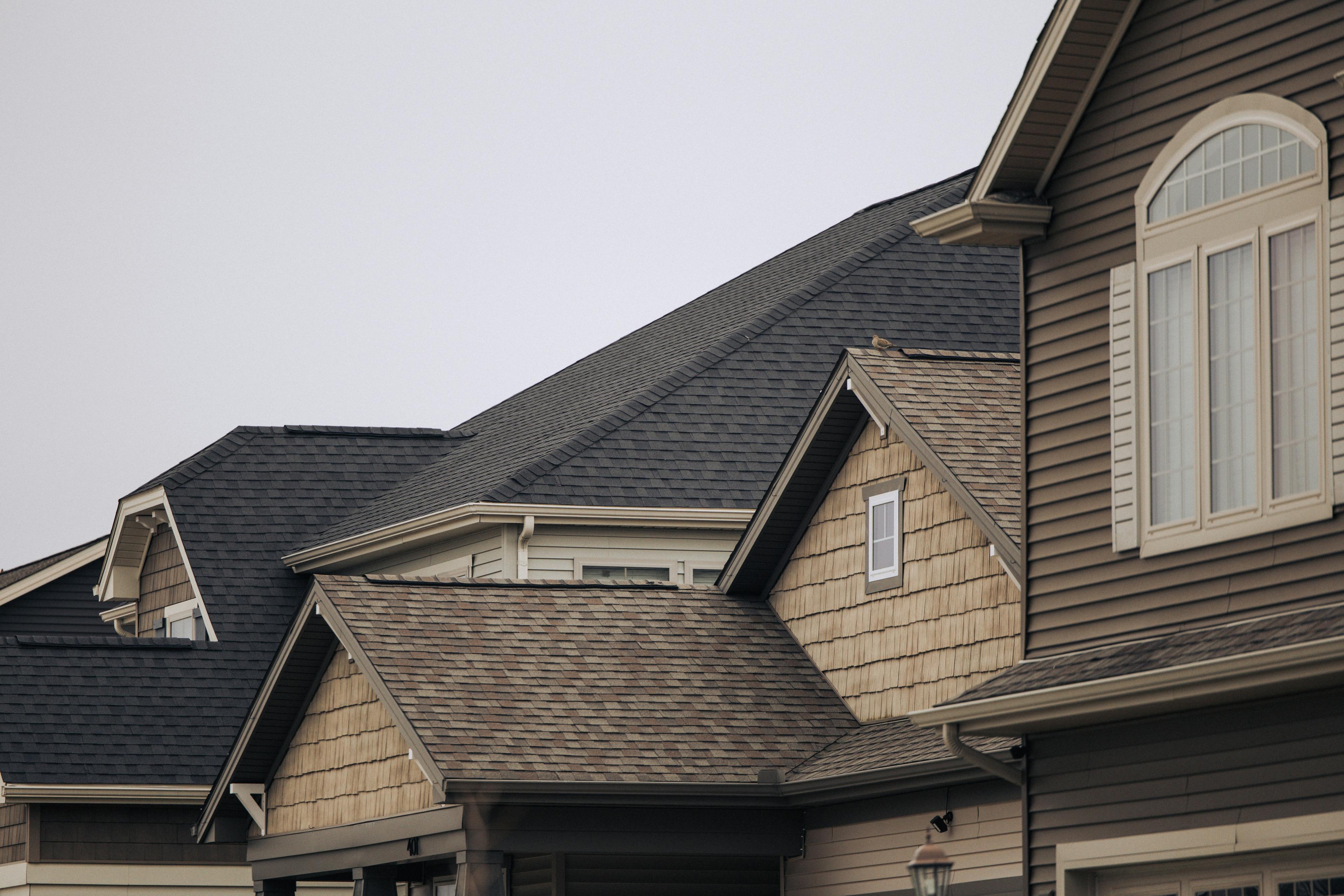 Completed asphalt shingle roof replacement on a two-story home in Jacksonville