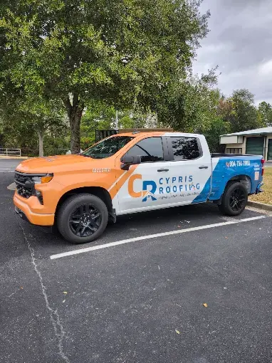 Cypris Roofing company truck on site at a completed roofing project